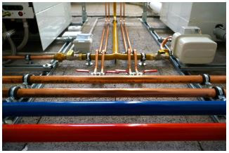Series of piping and other wall mounted equipment.