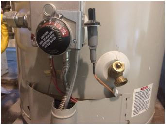 Hot water boiler showing close up shot of temperature dialer.
